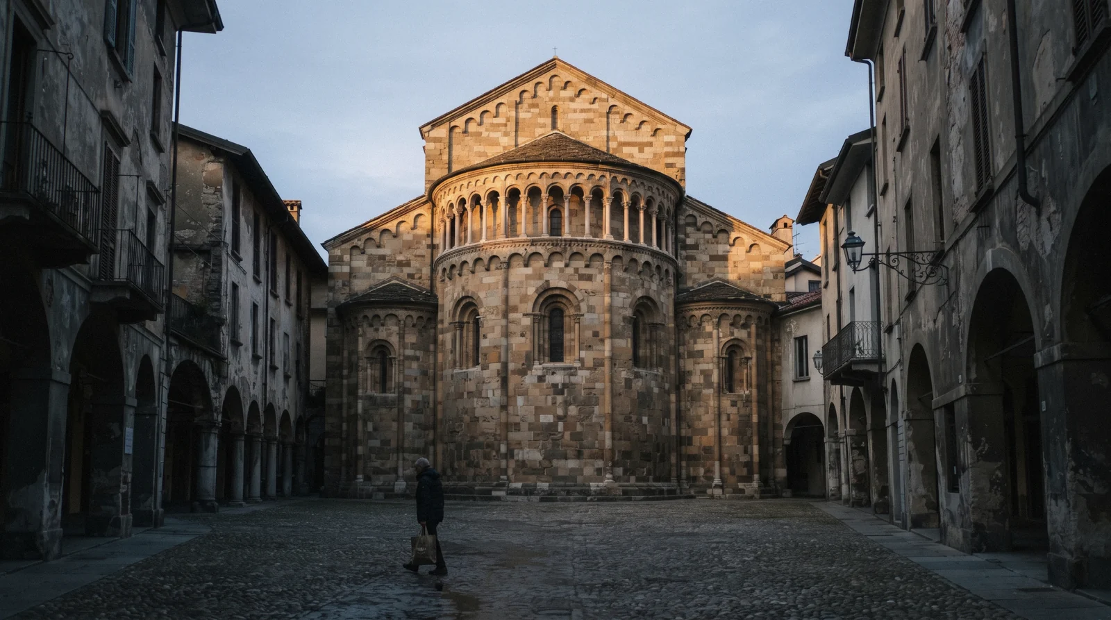 The stone apse and small loggia of the Basilica di San Fedele on Piazza San Fedele, the basilica di San Fedele Como in Como, Italy