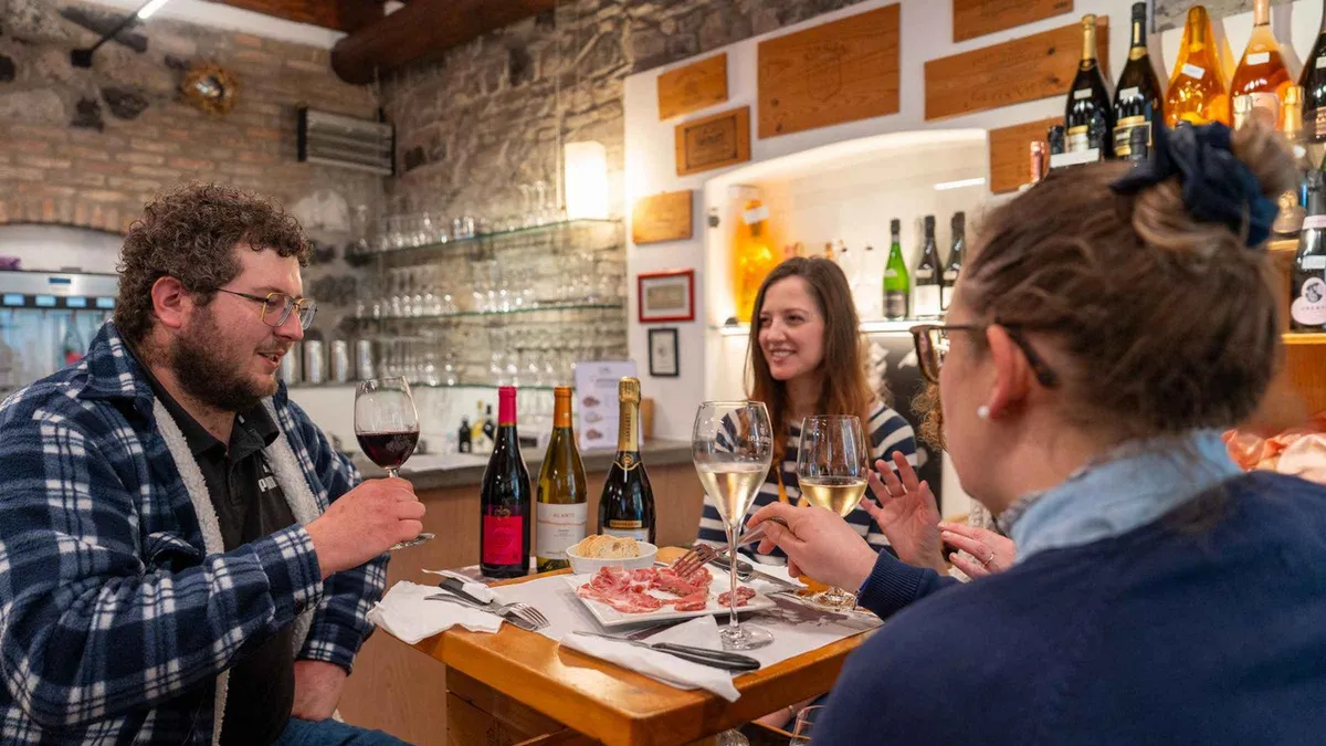 A plate of local cured meats and sciatt fritters at a Como food stop on a Lake Como food tour in Como, Italy